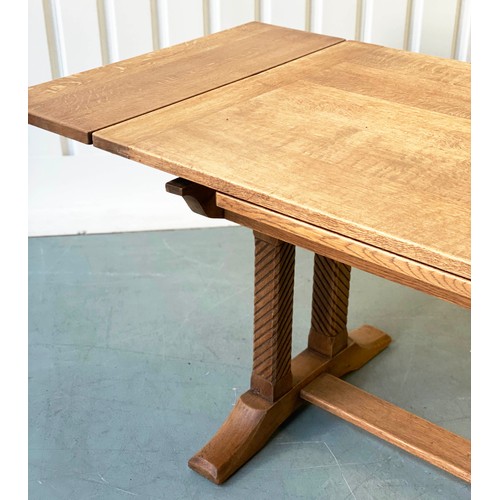 92 - DRAWLEAF EXTENDING DINING TABLE, early 20th century rectangular solid oak and cleated on twin trestl... 