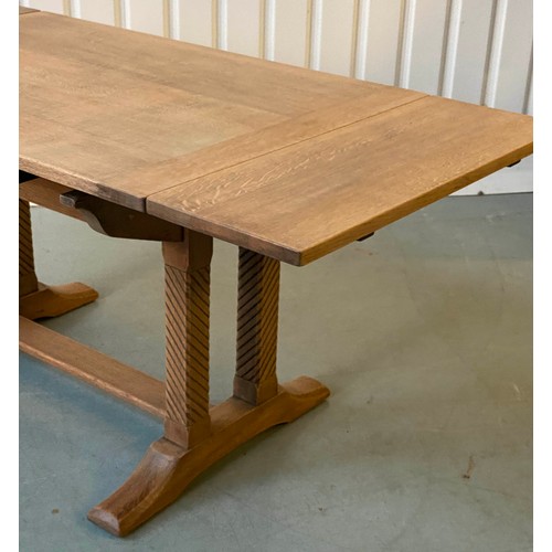 92 - DRAWLEAF EXTENDING DINING TABLE, early 20th century rectangular solid oak and cleated on twin trestl... 