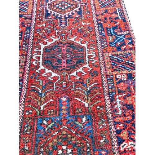 113 - ANTIQUE HERIZ RUNNER, 340cm x 86cm.