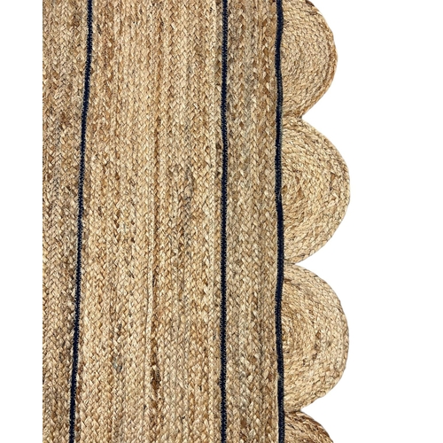 129 - SCALLOPED EDGE JUTE RUNNER, 370cm x 64cm.