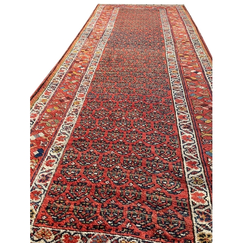 131 - ANTIQUE KURDISH RUNNER, 290cm x 111cm.