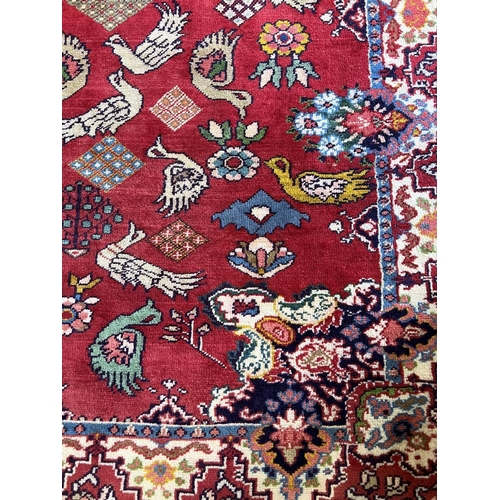 135 - PERSIAN BAKHTIARI CARPET, 295cm x 215cm, hand knotted wool.