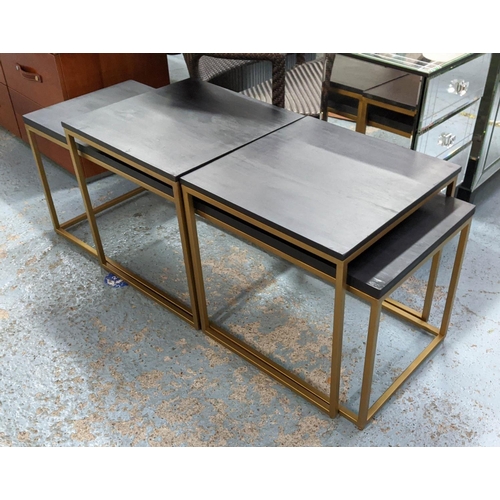 269 - COCKTAIL TABLES, a set of three, 120cm x 39cm x 46cm at largest, ebonised tops, gilt metal bases. (3... 