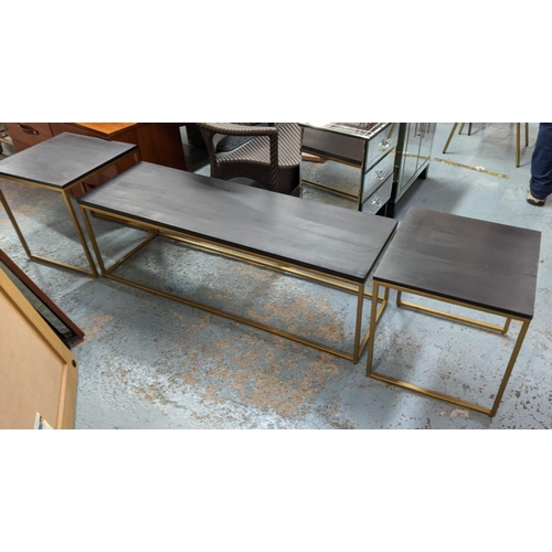 269 - COCKTAIL TABLES, a set of three, 120cm x 39cm x 46cm at largest, ebonised tops, gilt metal bases. (3... 