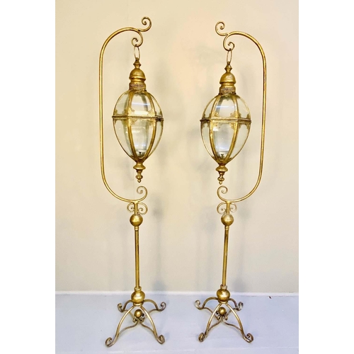 281 - LANTERNS ON STANDS, pair, 163cm H x 35cm W x 30cm D,  Regency style,gilt metal. (2)