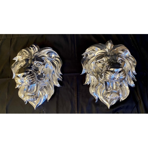 296 - ROARING LION HEADS WALL RELIEF METAL PLAQUES, pair, 49cm x 43cm x 24cm, silvered finish. (2)