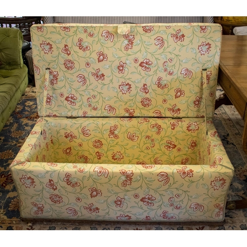 294 - OTTOMAN, 50cm H x 114cm W x 59cm D, Victorian and later in floral cream fabric on brass castors.