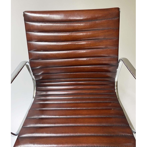 181 - REVOLVING DESK CHAIR, Charles and Ray Eames inspired with ribbed mid brown leather seat revolving an... 