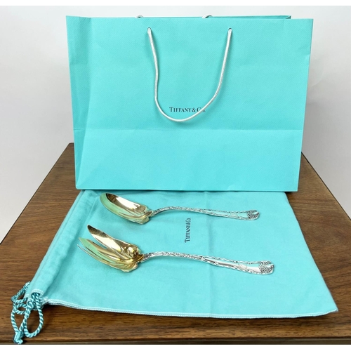 10 - TIFFANY AND CO STERLING SALAD SET, early 20th century parcel-gilded in Tiffany bags, 25cm L.