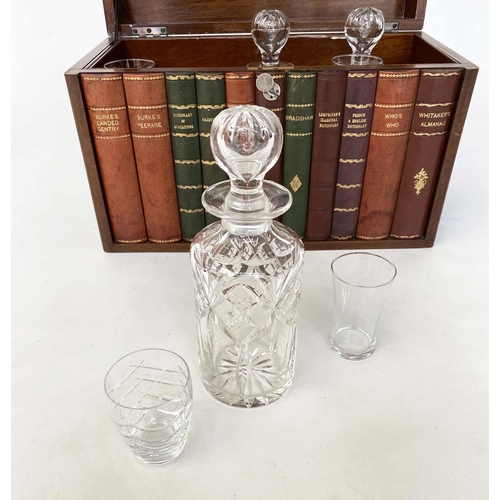 112 - TANTALUS, early 20th century figured walnut and faux book spine with three glass decanters, stamped ... 