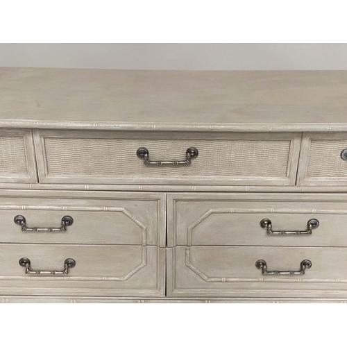 115 - FAUX BAMBOO LOW CHEST, traditionally grey painted and caned with panelled drawers above four further... 