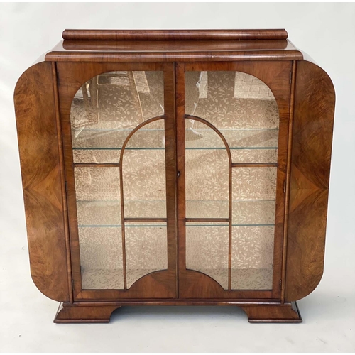 119 - ART DECO DISPLAY CABINET, walnut with a pair of arched glazed doors enclosing glass shelves, 122cm W... 