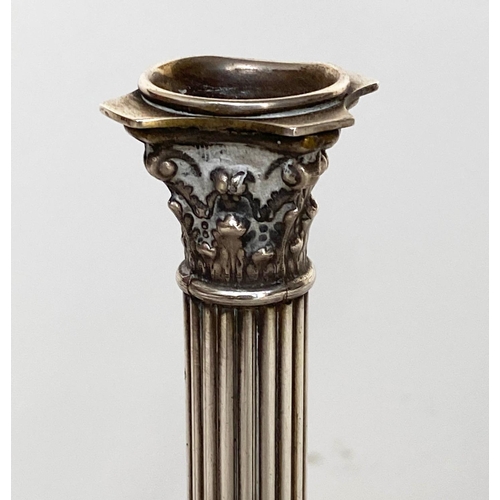 125 - CANDLESTICKS, a pair, early 20th century, Georgian style silvered with fluted columns and stepped pl... 