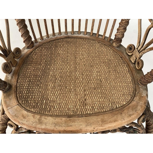 126 - ARMCHAIR, early 20th century 1930s rattan frame and green and natural intricately cane woven with st... 