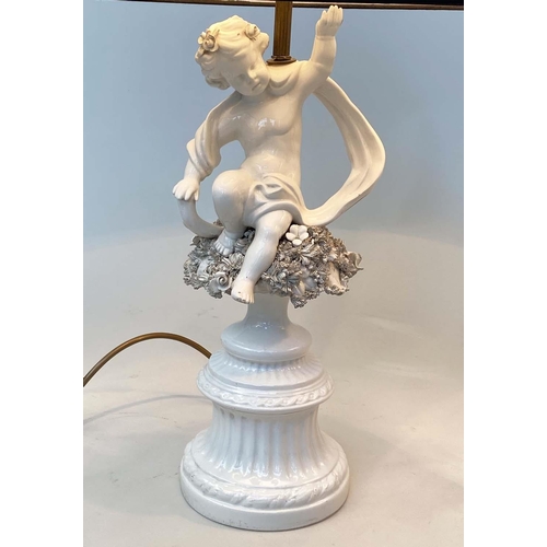 129 - TABLE LAMPS, a pair, 20th century Italian white ceramic, each with seated cupid support (old repairs... 