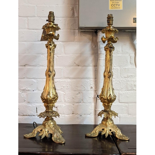 205 - ORMOLU CANDLESTICKS, a pair, 59cm H converted into table lamps. (2)