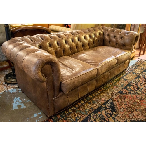 217 - CHESTERFIELD SOFA, 78cm H x 212cm x 92cm, three seater in tan leather.