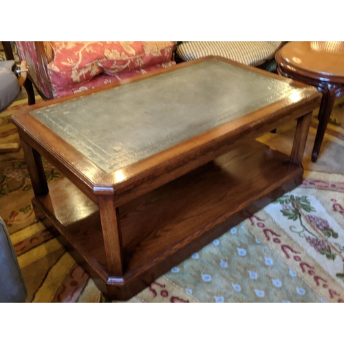 221 - COFFEE TABLE, 102cm x 46cm H x 63cm, oak with green leather top and canted corners.