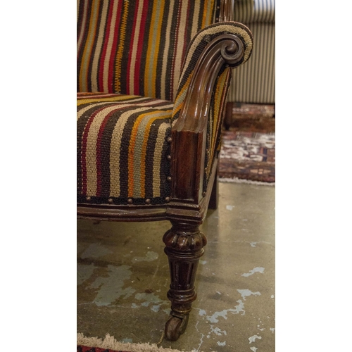 231 - ARMCHAIR, 90cm H x 82cm W, Victorian mahogany, circa 1870, in striped kilim with front castors.