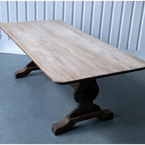 255 - REFECTORY DINING TABLE, round rectangular oak, planked and raised upon shaped trestle supports with ... 