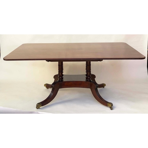 281 - DINING TABLE, Regency period rounded rectangular figured mahogany raised upon four pillar outswept s... 