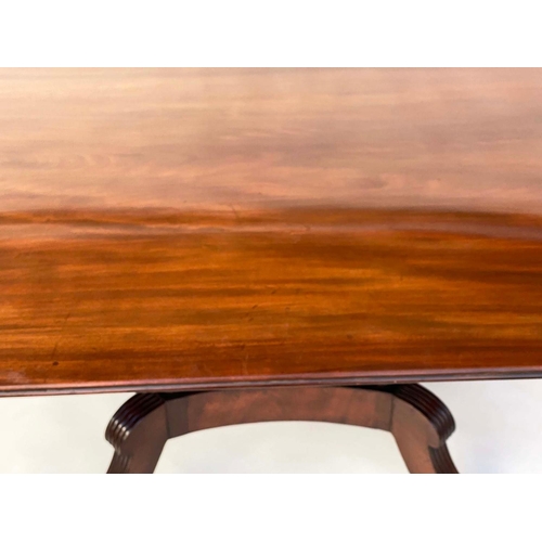 281 - DINING TABLE, Regency period rounded rectangular figured mahogany raised upon four pillar outswept s... 