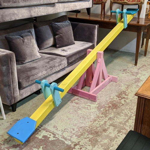 378 - FASHION SHOOT SET PROP SEESAW, 310cm L approx, painted finish.