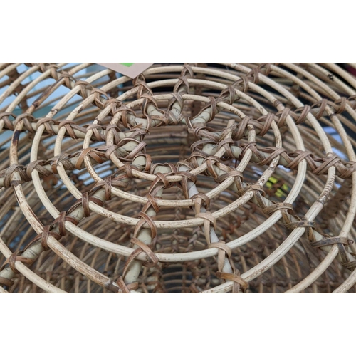 448 - NEST OF DRUM TABLES, a graduated set of three, bamboo, 80cm x 46cm at largest.