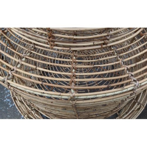 448 - NEST OF DRUM TABLES, a graduated set of three, bamboo, 80cm x 46cm at largest.