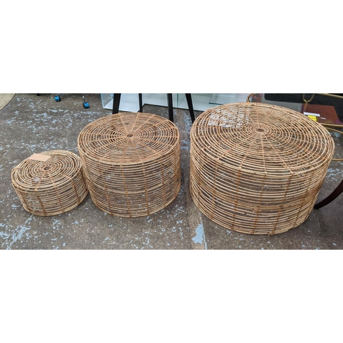 448 - NEST OF DRUM TABLES, a graduated set of three, bamboo, 80cm x 46cm at largest.