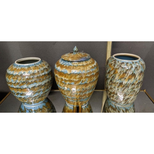 463 - PAOLO MOSCHINO MELON MIXED GLAZE JARS, a pair and a round jar to match, 35cm at tallest. (3)