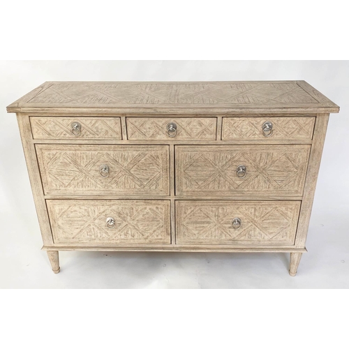 514 - OKA STYLE CHEST, painted with lattice moulded front and seven drawers, 130cm x 45cm D x 90cm H.