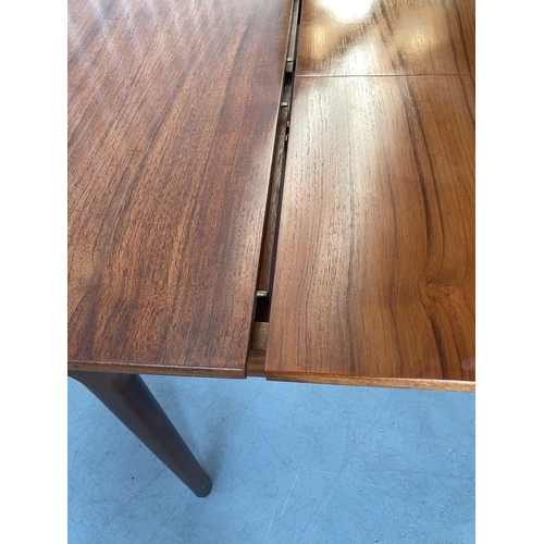 517 - MCINTOSH EXTENDING DINING TABLE, 1970's solid teak shaped rounded rectangular with two foldout hinge... 