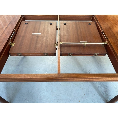 517 - MCINTOSH EXTENDING DINING TABLE, 1970's solid teak shaped rounded rectangular with two foldout hinge... 