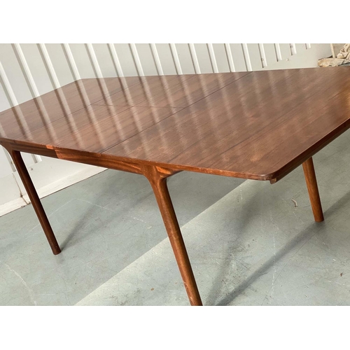 517 - MCINTOSH EXTENDING DINING TABLE, 1970's solid teak shaped rounded rectangular with two foldout hinge... 