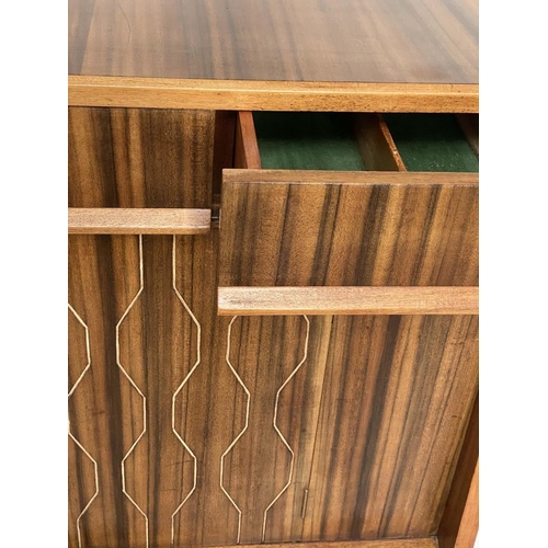 518 - EVEREST SIDEBOARD, 1960's walnut and Indian laurel with incised double helix doors and three frieze ... 