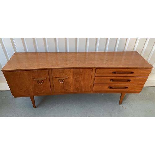 522 - SIDEBOARD, 1970's teak, concave fronted with cupboards and drawers, 184cm x 46cm x 77cm H.