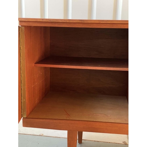 522 - SIDEBOARD, 1970's teak, concave fronted with cupboards and drawers, 184cm x 46cm x 77cm H.