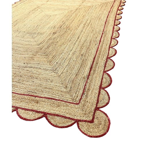 121 - SCALLOPED EDGE JUTE RUG, 315cm x 257cm.