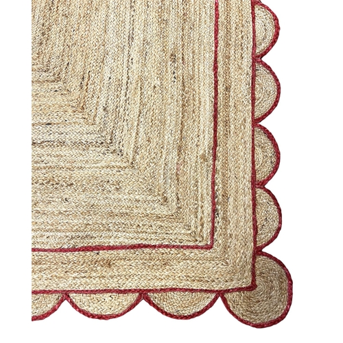 121 - SCALLOPED EDGE JUTE RUG, 315cm x 257cm.