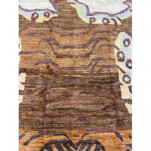 136 - TIBETAN TIGER RUG, 243cm x 170cm.