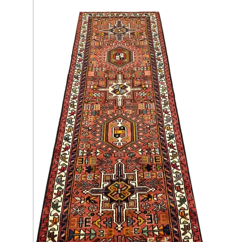 143 - PERSIAN HERIZ LONG RUNNER, 485cm x 75cm.