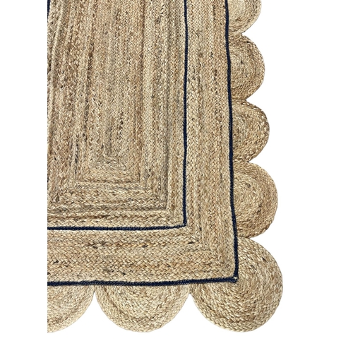 153 - SCALLOPED EDGE JUTE RUNNER, 308cm x 92cm.