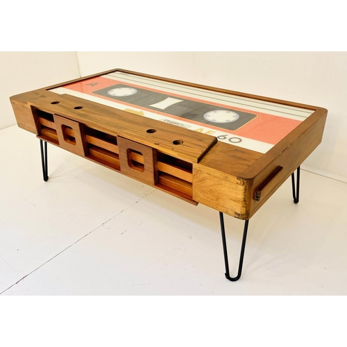 533 - CASSETTE TAPE COCKTAIL TABLE, with storage along one side, on hair pin legs 40cm x 110cm x 60cm.