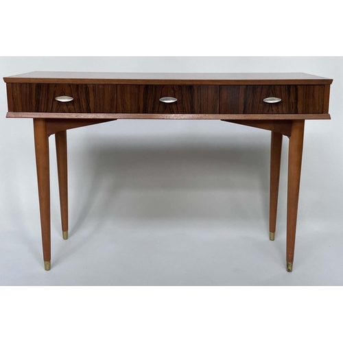 390 - HERBERT E GIBBS WRITING TABLE, 1960s teak and Indian laurel with three frieze drawers and tapering b... 