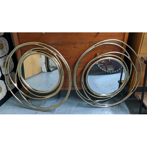 436 - WALL MIRRORS, a pair, abstract gilt metal frames, 67cm diam. (2)