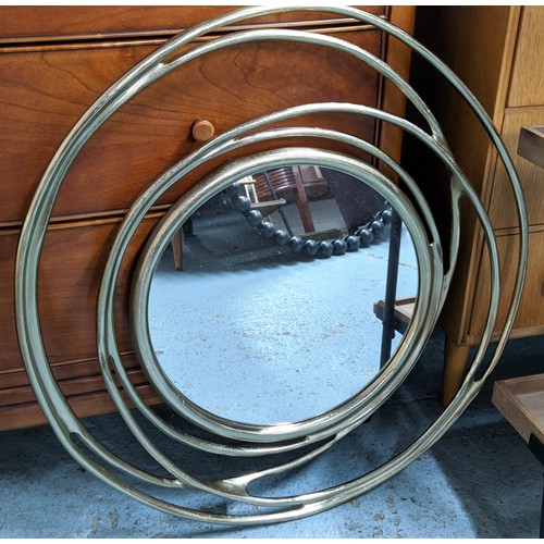 436 - WALL MIRRORS, a pair, abstract gilt metal frames, 67cm diam. (2)