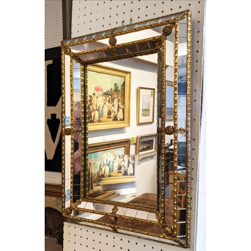 170 - CUSHION MIRRORS, a pair, each 32cm D x 46cm H, with decorative brass detail. (2)