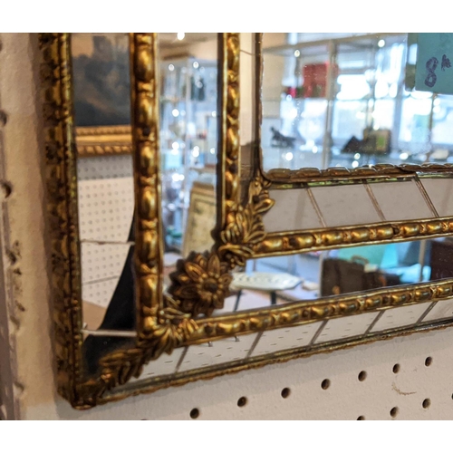 170 - CUSHION MIRRORS, a pair, each 32cm D x 46cm H, with decorative brass detail. (2)