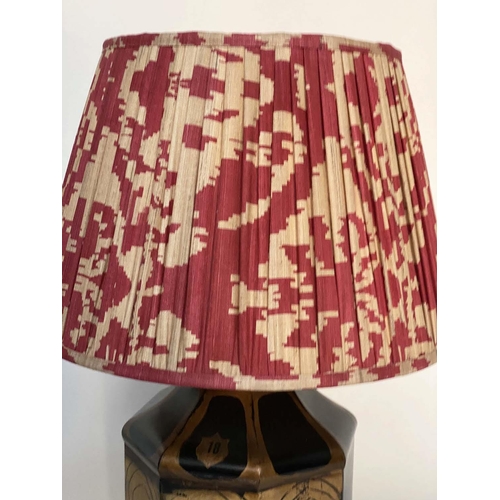 204 - OKA TABLE LAMPS, a pair, canister form gilded and painted with terracotta pleated fabric shades, 78c... 